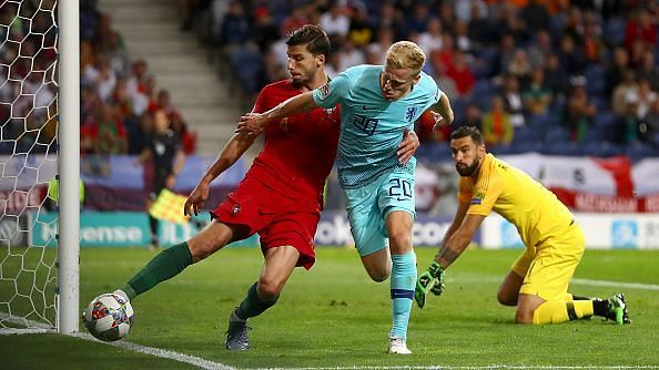 Van de Beek (right) fights for the ball in Netherlands' UEFA Nations final against Portugal